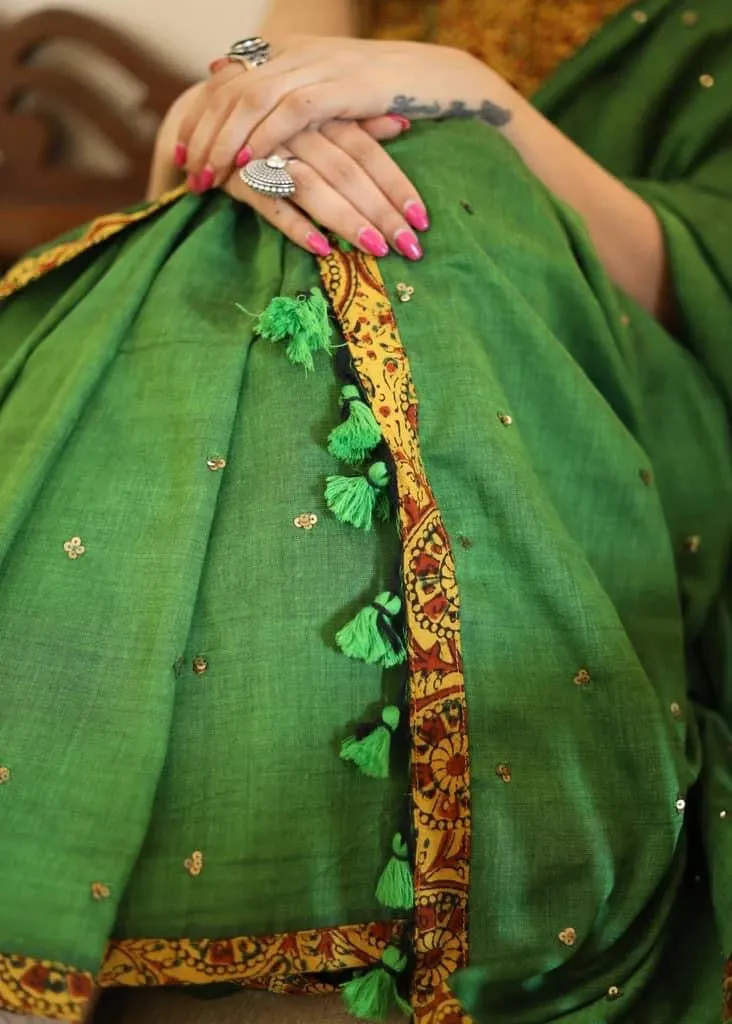 GREEN COTTON SAREE WITH YELLOW AJRAKH BORDER AND GOLDEN EMBELLISHMENT