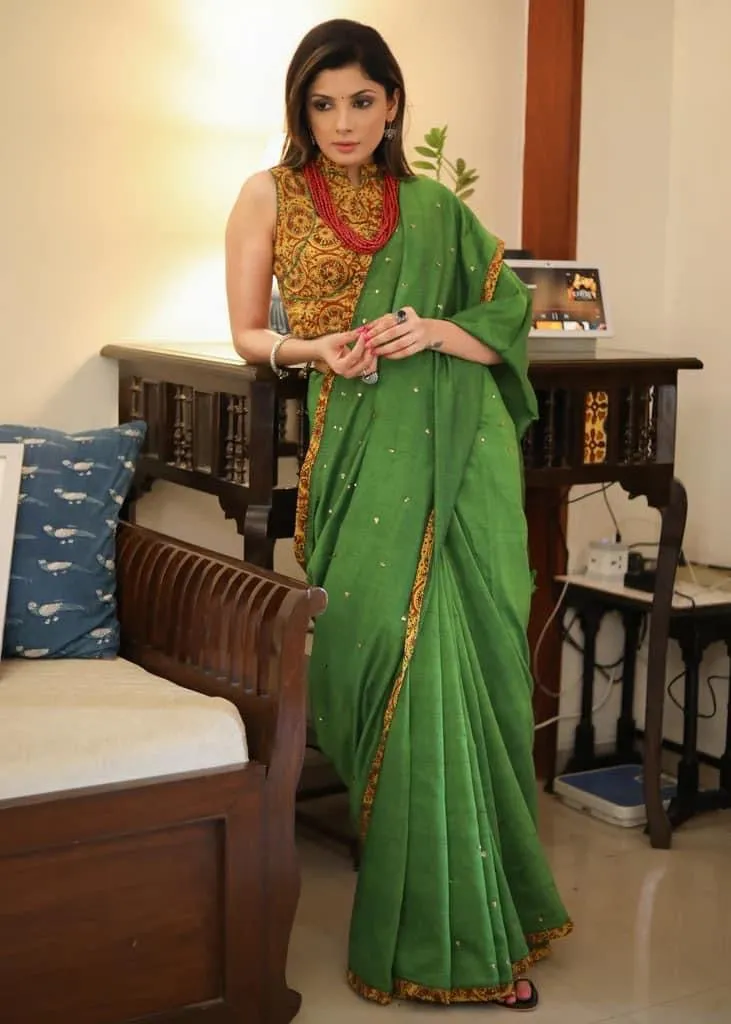GREEN COTTON SAREE WITH YELLOW AJRAKH BORDER AND GOLDEN EMBELLISHMENT